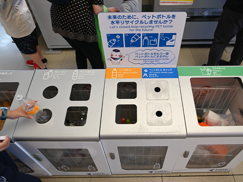 Trash bins for sorting plastic bottles.