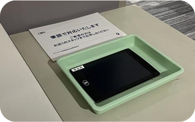 A tablet for writing provided for hearing-impaired customers at the security checkpoint.